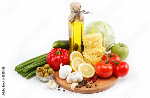 set fresh vegetables with olive oil isolated on white background
