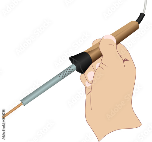 A hand with an electric soldering iron