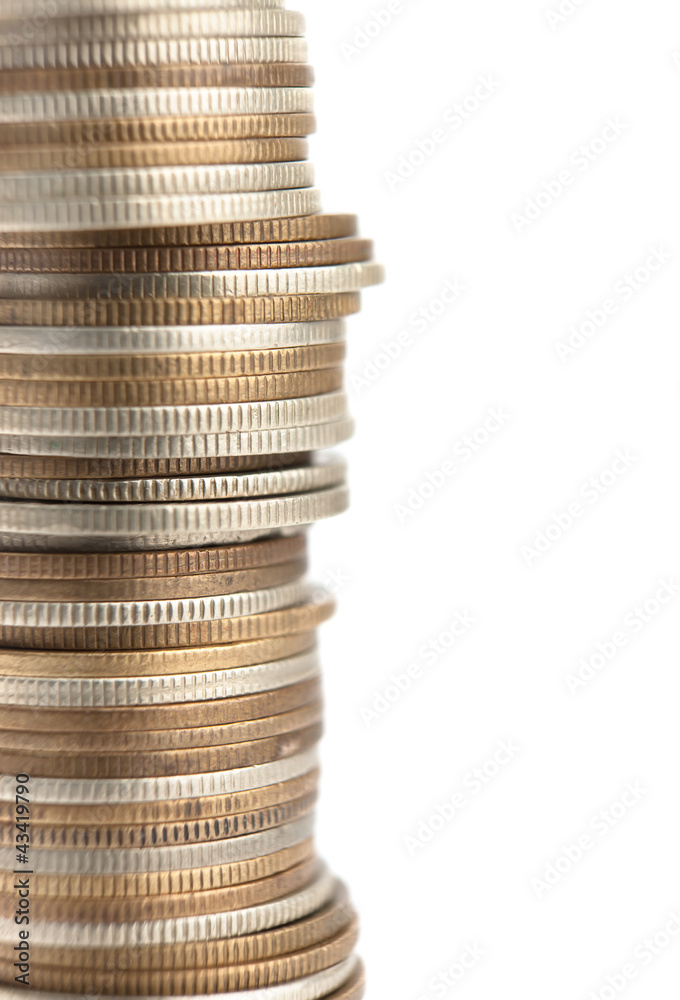 Gold, bronze and silver coins stand vertically in column Gold, bronze and silver coins stand vertically in column