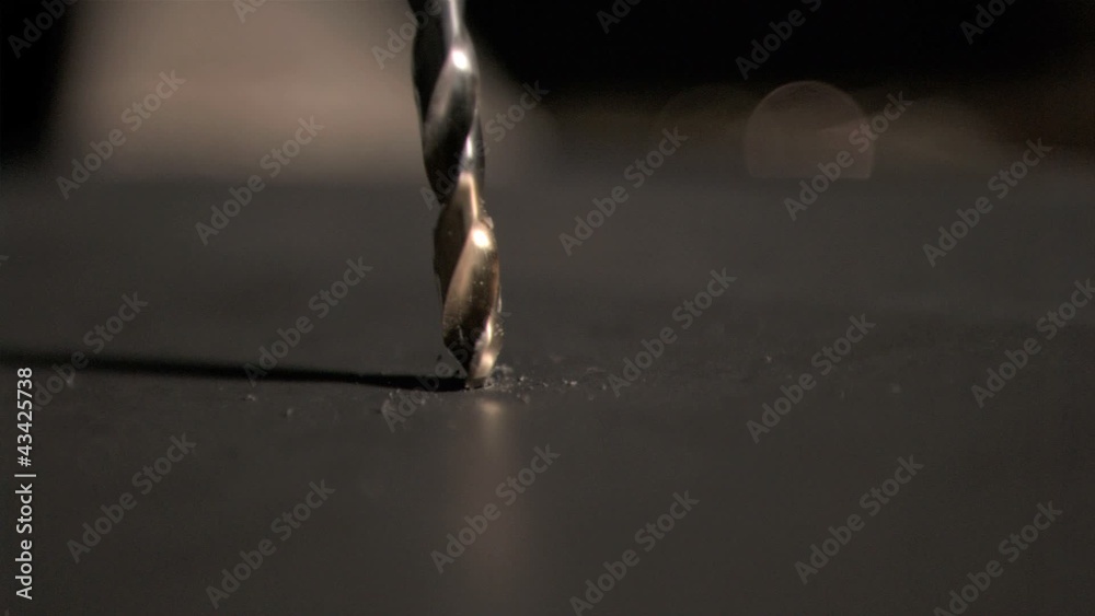 Drill bit piercing in super slow motion