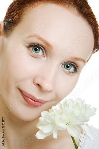 Portrait of beautiful young woman with  flowers