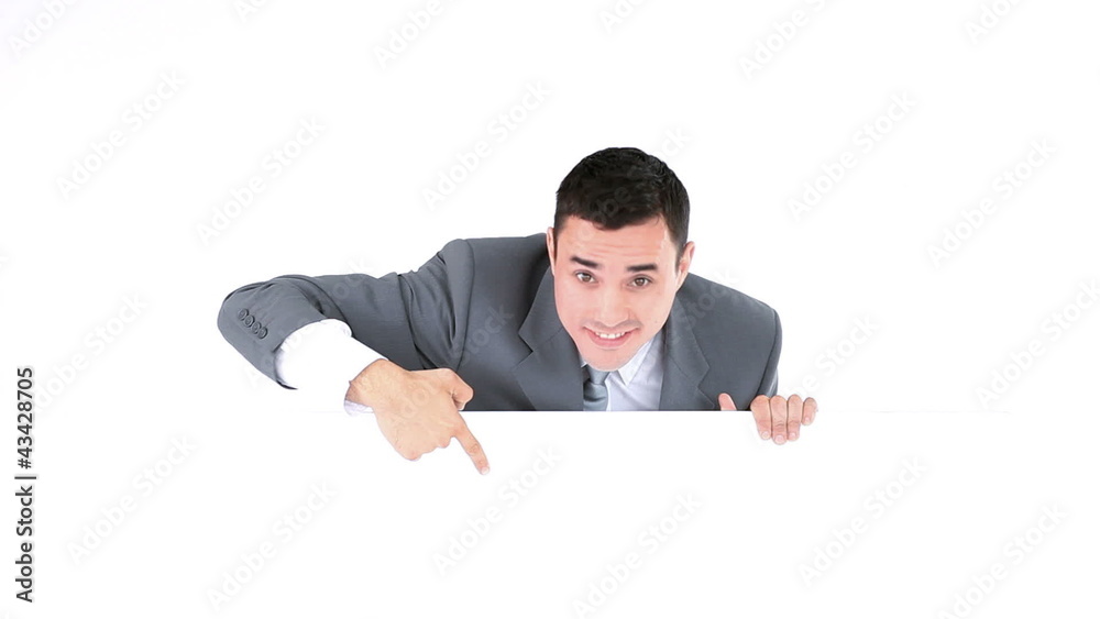 Businessman pointing something on a board Businessman pointing something on a board