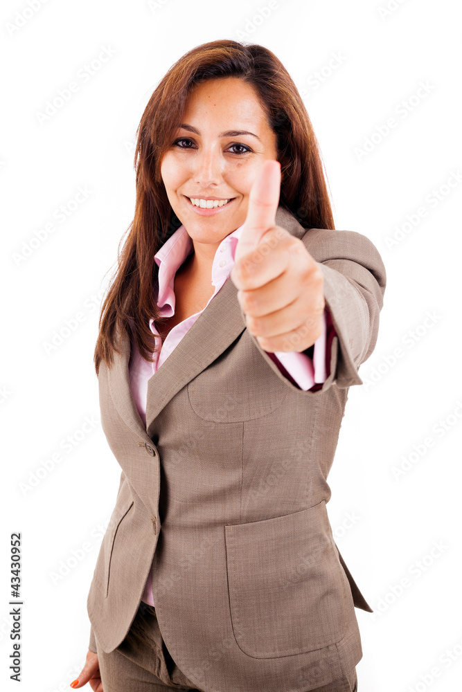 Smiling young business woman with thumbs up gesture, isolated on Smiling young business woman with thumbs up gesture, isolated on
