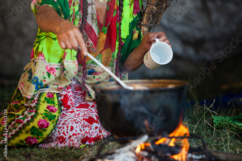 Gypsy prepares food.