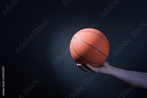 Player plays with a basketball © papa