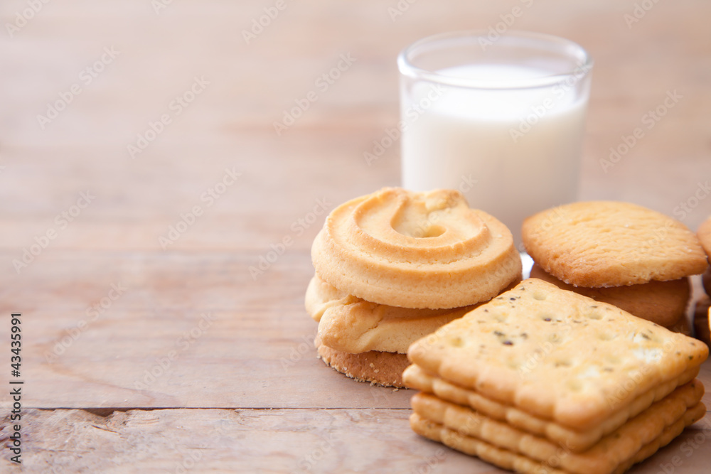 Milk with cookie on wood table Milk with cookie on wood table