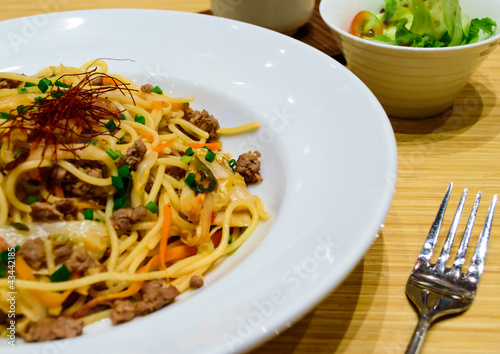 Spagetti with kimchi mixed minced meat beef and Japanese salad.
