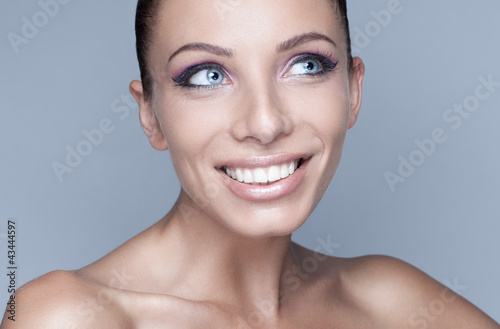 Portrait of happy brunette woman with beautiful eyes