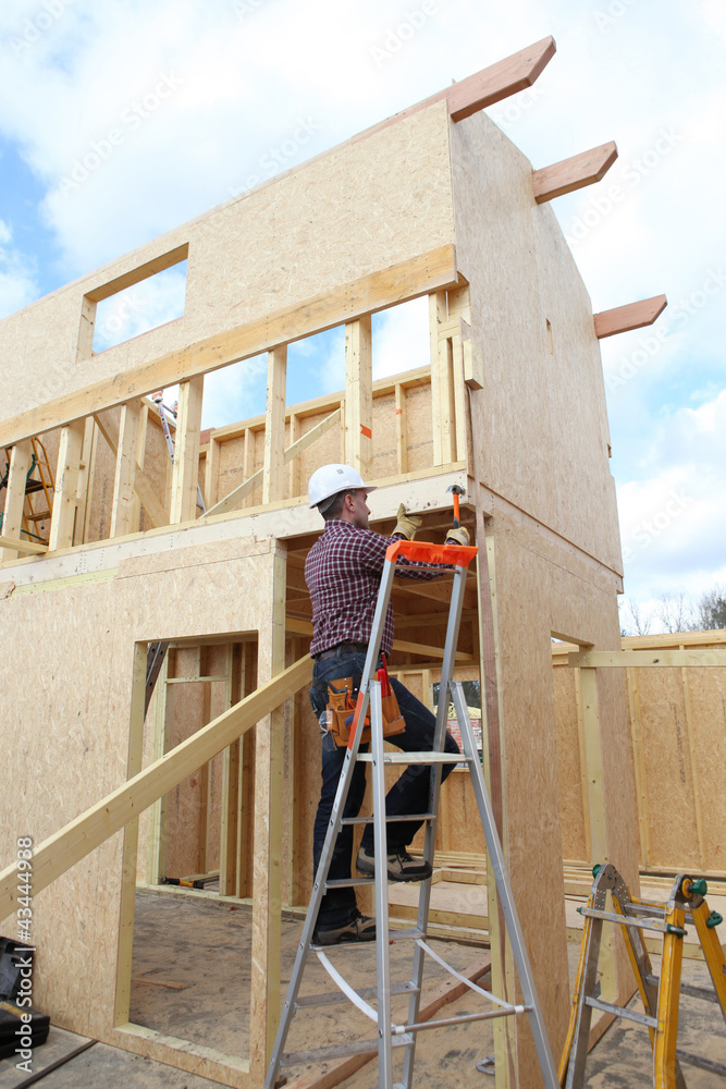 Construction worker building a house Construction worker building a house