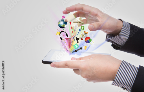 Business man using a touch screen device against white backgroun