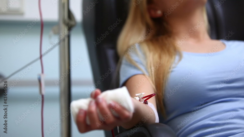 Blonde patient receiving a blood transfusion