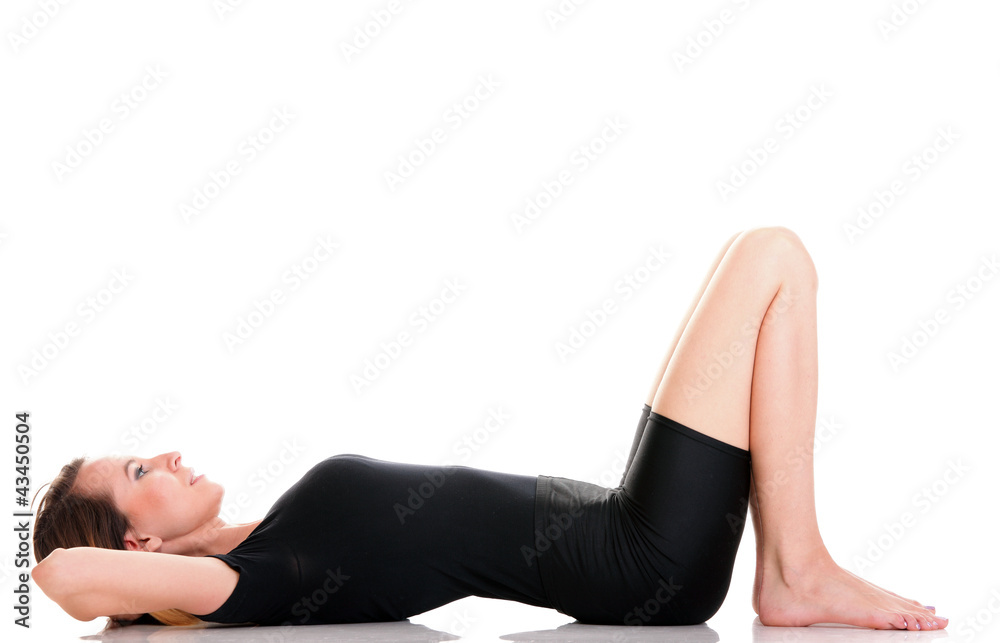 Sport Young woman doing exercise isolated on white Sport Young woman doing exercise isolated on white