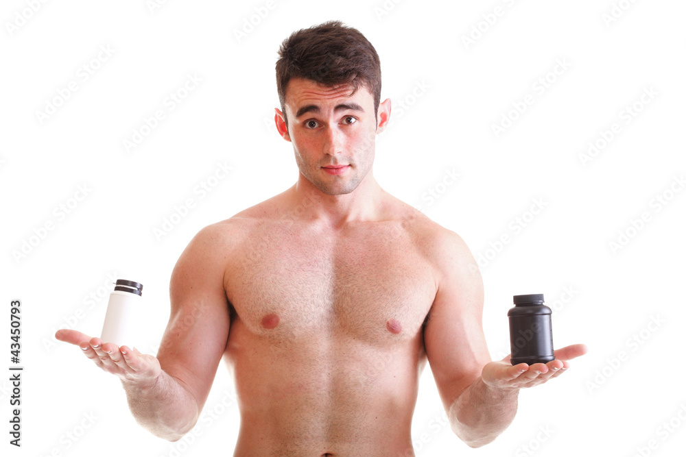 Fototapeta premium holding a boxes with supplements on his biceps