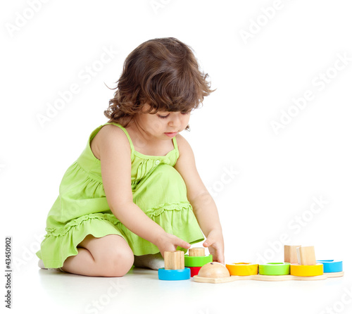 little kid girl playing wit...