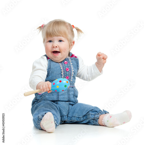 Kid playing with musical to...