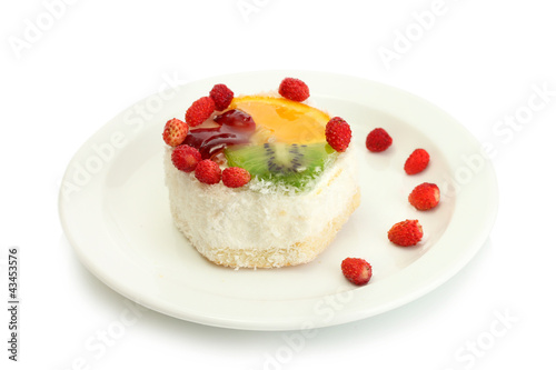 sweet cake with fruits on plate isolated on white