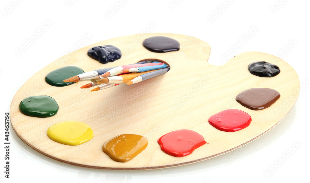 wooden art palette with paint and brushes.isolated on white wooden art palette with paint and brushes.isolated on white