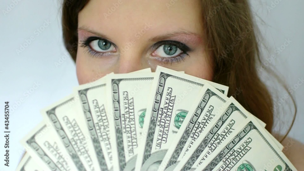 Beautiful young woman is holding bunch of money. Dollar Beautiful young woman is holding bunch of money. Dollar