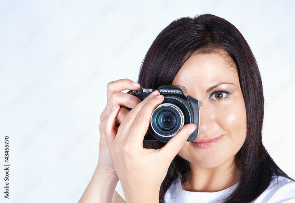 young woman holding digital camera young woman holding digital camera