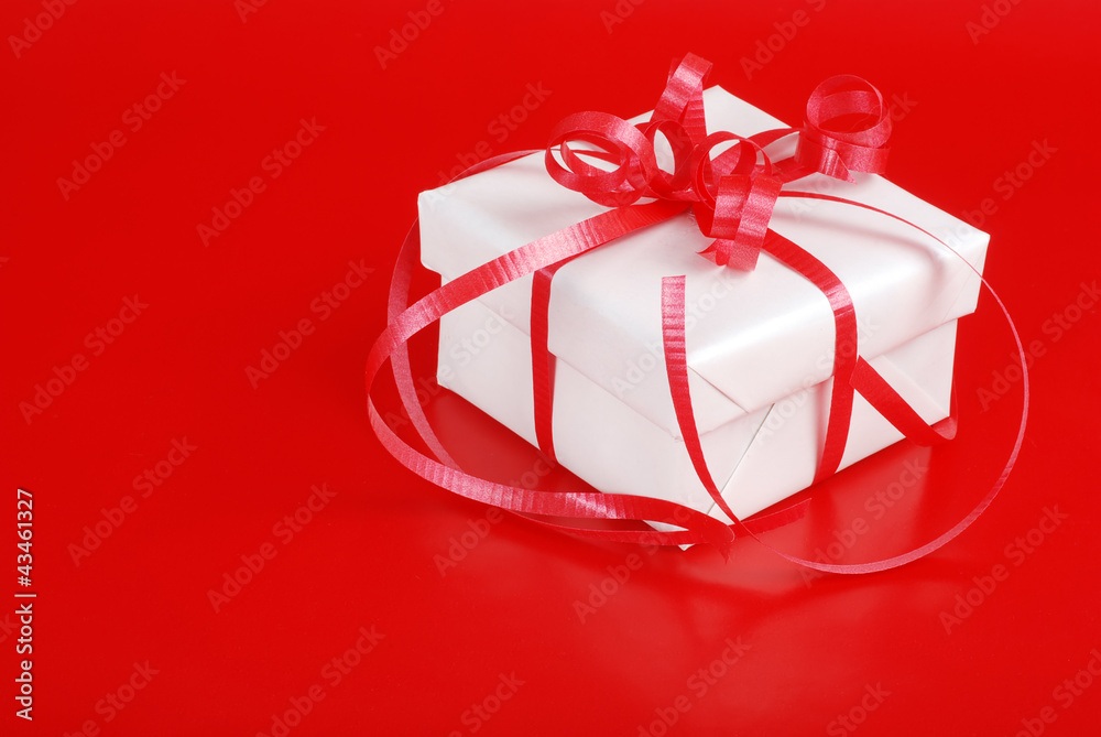 White christmas gift with red ribbon White christmas gift with red ribbon
