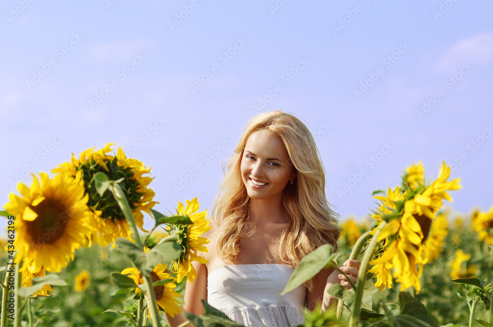 young beautiful woman on field in summer young beautiful woman on field in summer