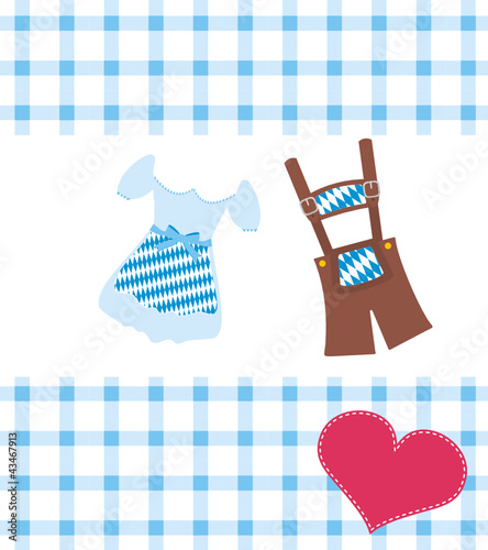 Dirndl und Lederhose auf karierter Decke mit Herz