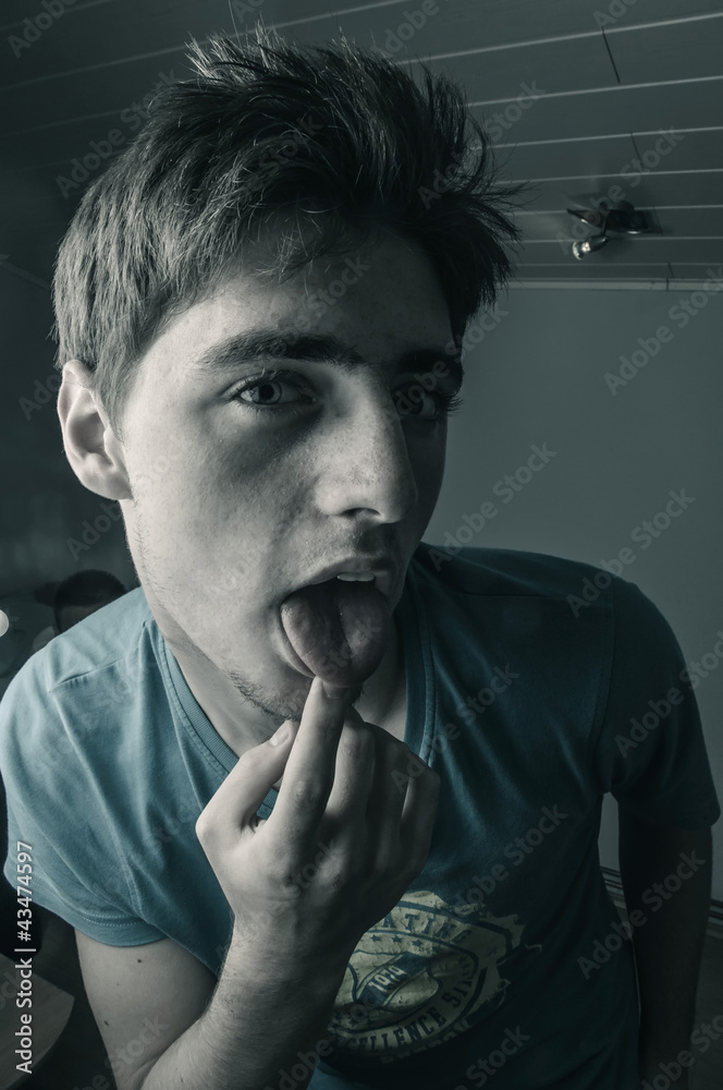 Man licking finger Man licking finger