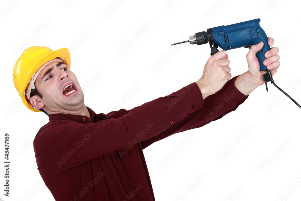 Man afraid of a power drill Man afraid of a power drill