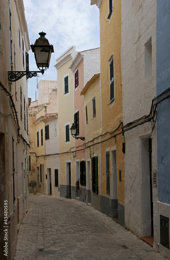 Street with colorful houses in old town of Ciutadella - Minorca