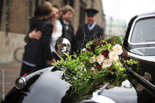Beautiful bridal bouquet on car bonnet
