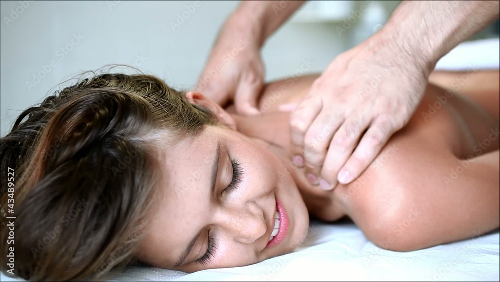 Young woman getting a massage at the spa
