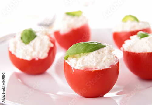 stuffed cherry tomato with cheese cream