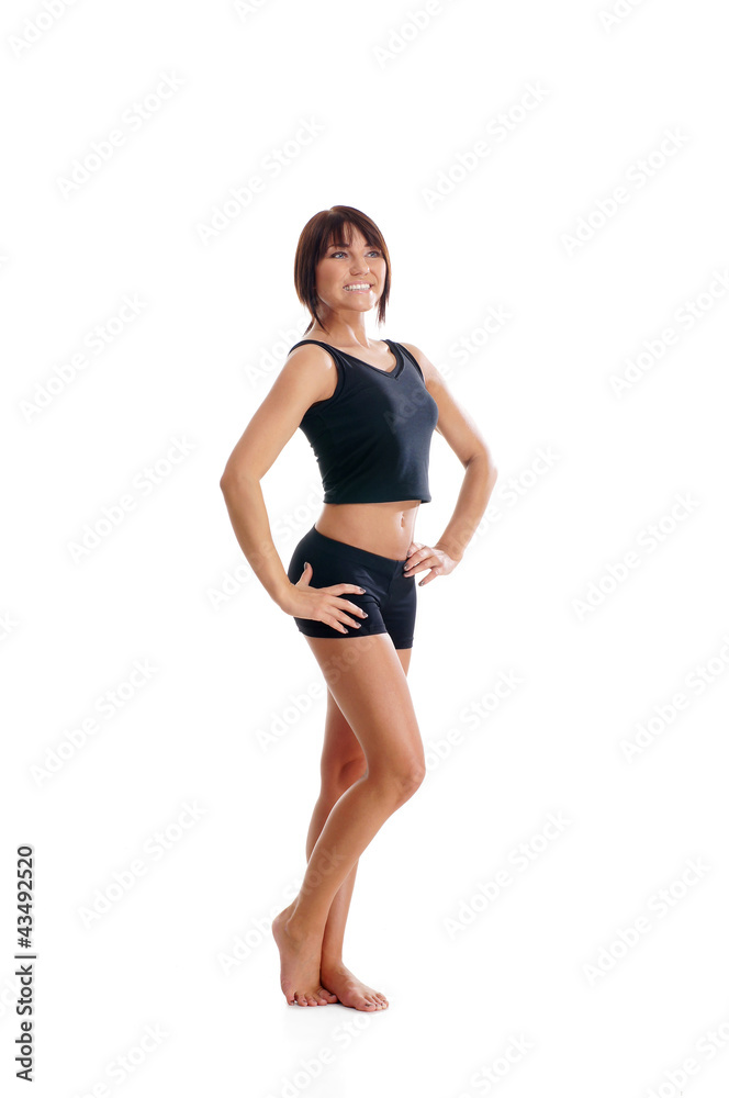 A young and sporty brunette woman doing a stretching exercise A young and sporty brunette woman doing a stretching exercise