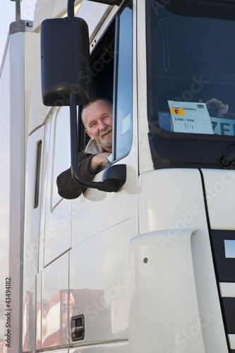 Fotografie Truck driver and his truck.