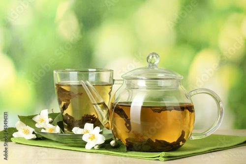 green tea with jasmine in cup and teapot