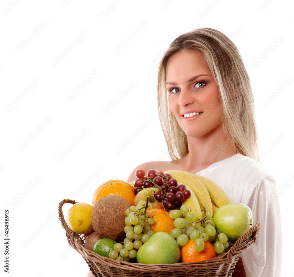 A young blond woman holding a crate full of fresh fruits A young blond woman holding a crate full of fresh fruits