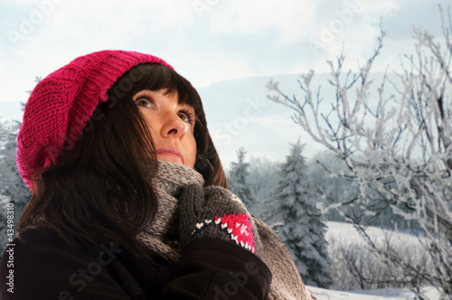 woman in winter clothes and winter landscape