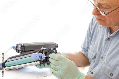 adult man working toner cartridge