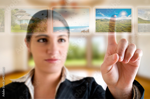 Young successful woman planning her vacations choosing options f