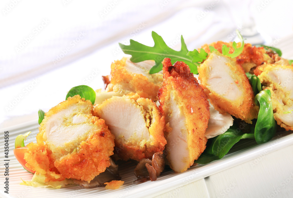 Breaded chicken breast with salad greens Breaded chicken breast with salad greens