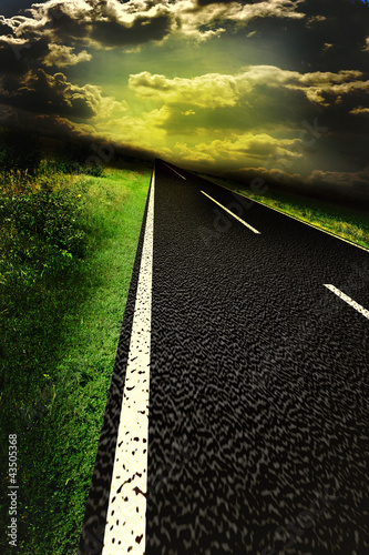 фотографія Asphalt road and red bloody blurred sky with sun