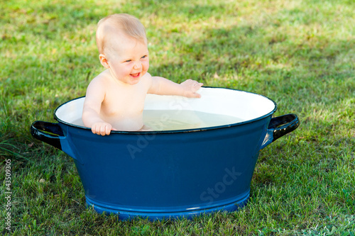 little girl take a bath in vintage tube