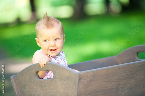 little child in old wagon trolley