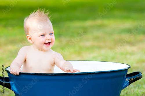 little girl take a bath in vintage tube