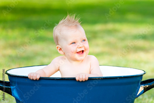 little girl take a bath in vintage tube