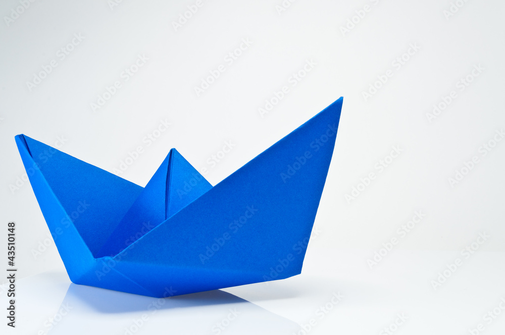 Close up origami paper ship on white background. Close up origami paper ship on white background.