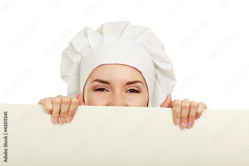 Happy woman cook or baker holding over paper sign billboard. Happy woman cook or baker holding over paper sign billboard.