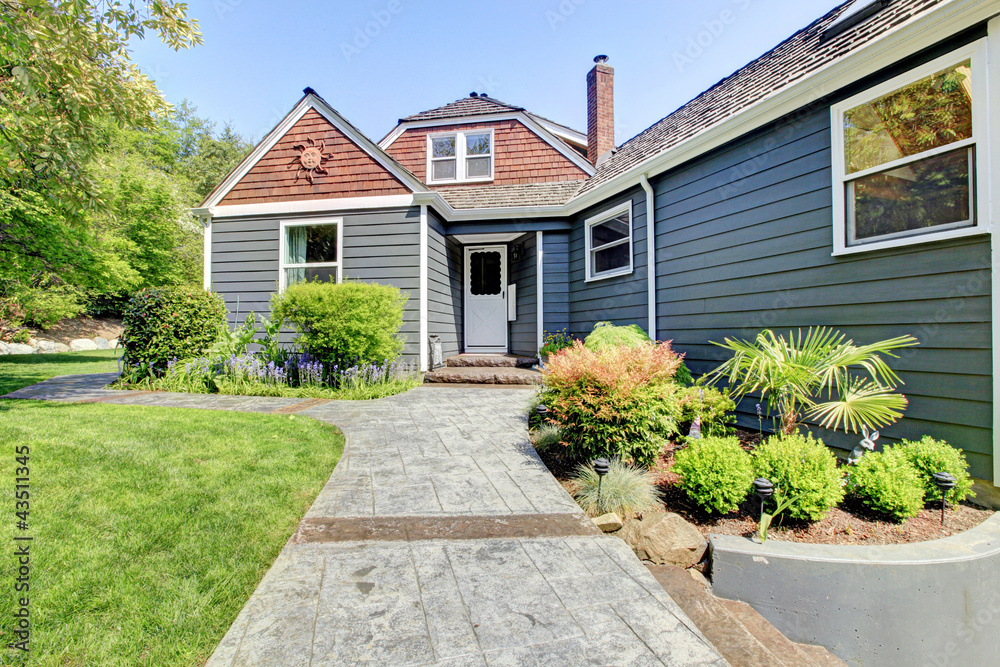 Blue grey house exterior with green landscape. Blue grey house exterior with green landscape.