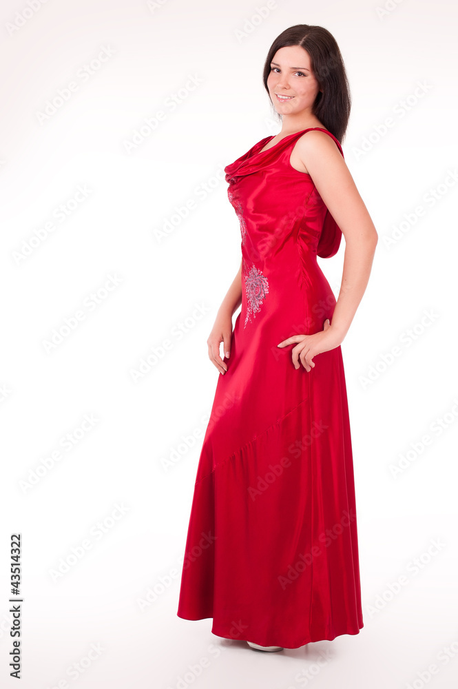 Beautiful young woman wearing a sexy red evening dress