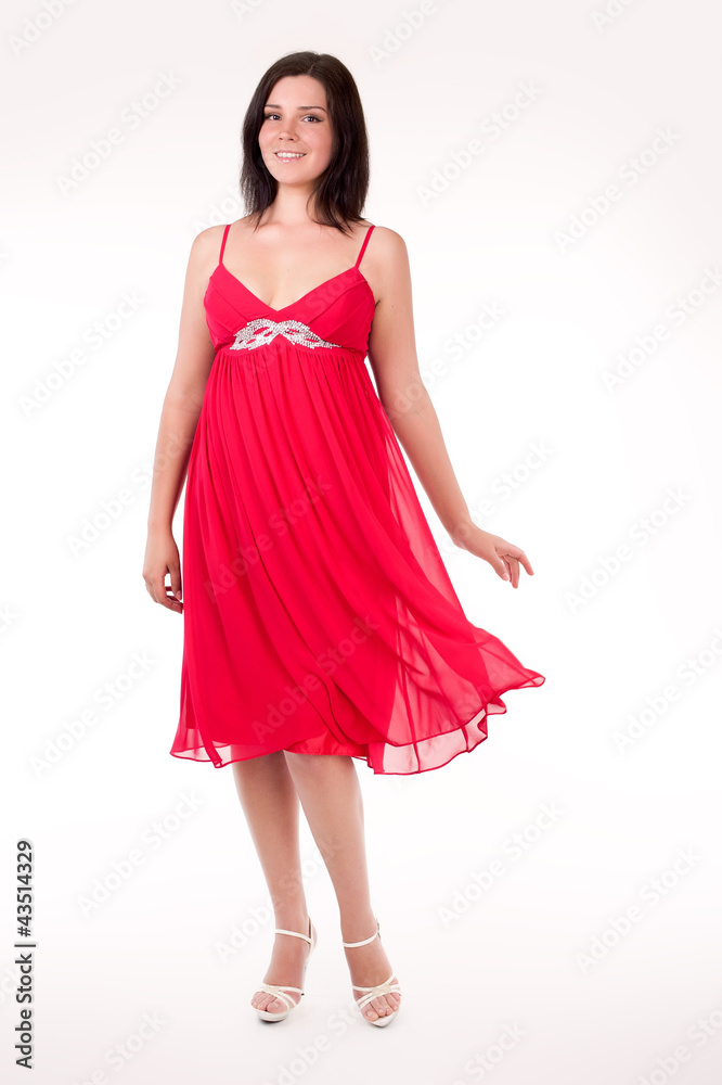 Beautiful young woman wearing a sexy red evening dress Beautiful young woman wearing a sexy red evening dress